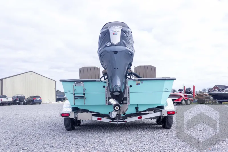 Slide: The Image of 2026 Vexus ACX 2150 boat on trailer, rear view, outdoor setting. - 11