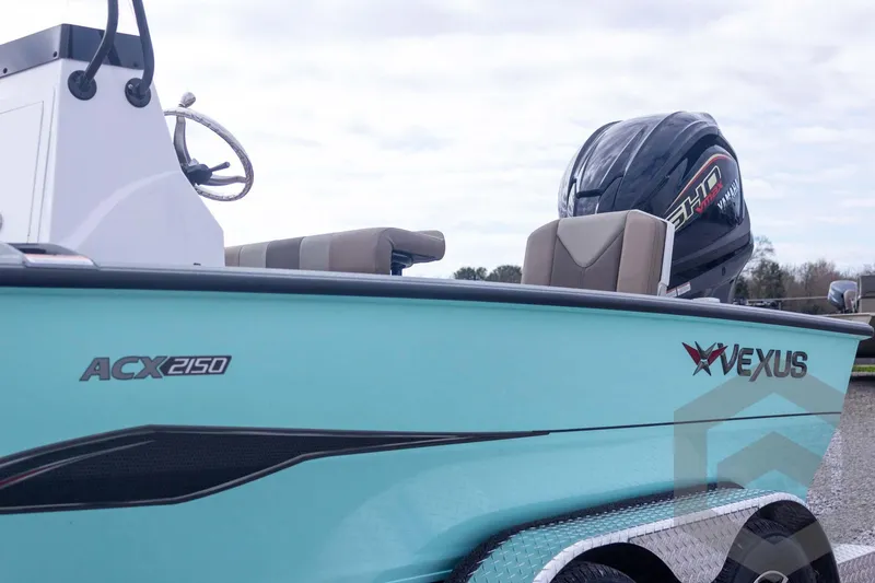 Slide: The Image of 2026 Vexus ACX 2150 boat with outboard motor, side view. - 14