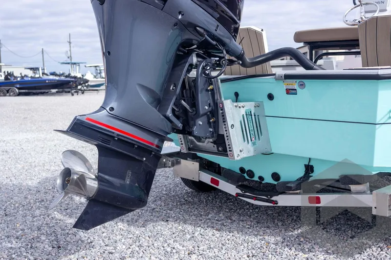 Slide: The Image of 2026 Vexus ACX 2150 boat with outboard motor on a trailer, displayed outdoors. - 19