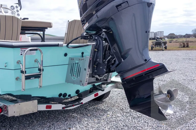 Slide: The Image of 2026 Vexus ACX 2150 boat with powerful outboard motor and ladder on gravel surface. - 20