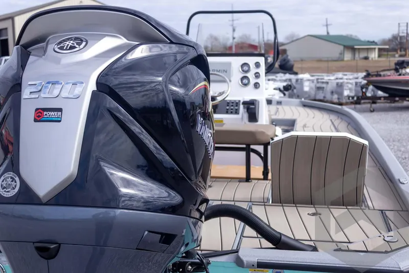 Slide: The Image of 2026 Vexus ACX 2150 boat with powerful 200 HP engine, sleek design, and modern controls. - 22