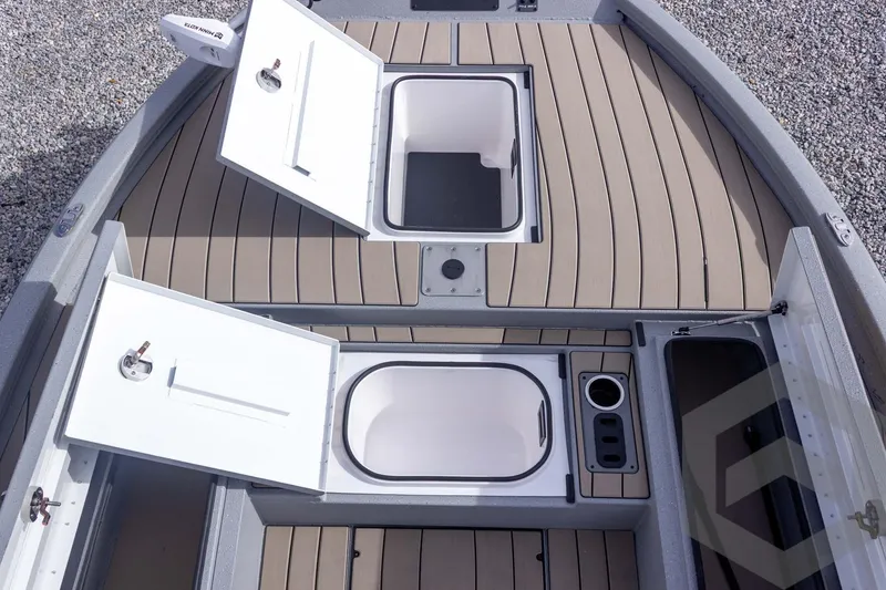 Slide: The Image of 2026 Vexus ACX 2150 boat deck with open storage compartments and sleek design. - 25