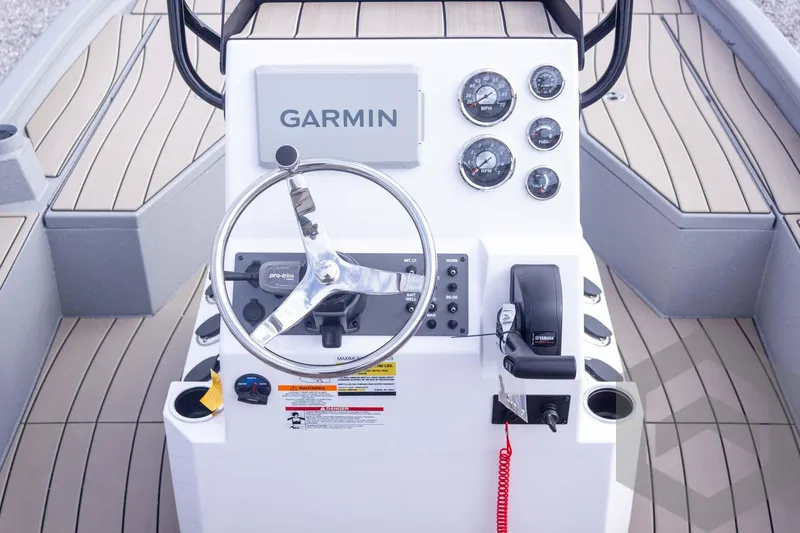 Slide: The Image of 2026 Vexus ACX 2150 boat dashboard with Garmin navigation and control panel. - 36