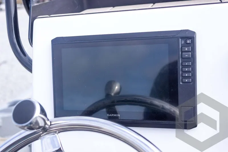 Slide: The Image of Garmin display on 2026 Vexus ACX 2150 boat dashboard with steering wheel. - 39