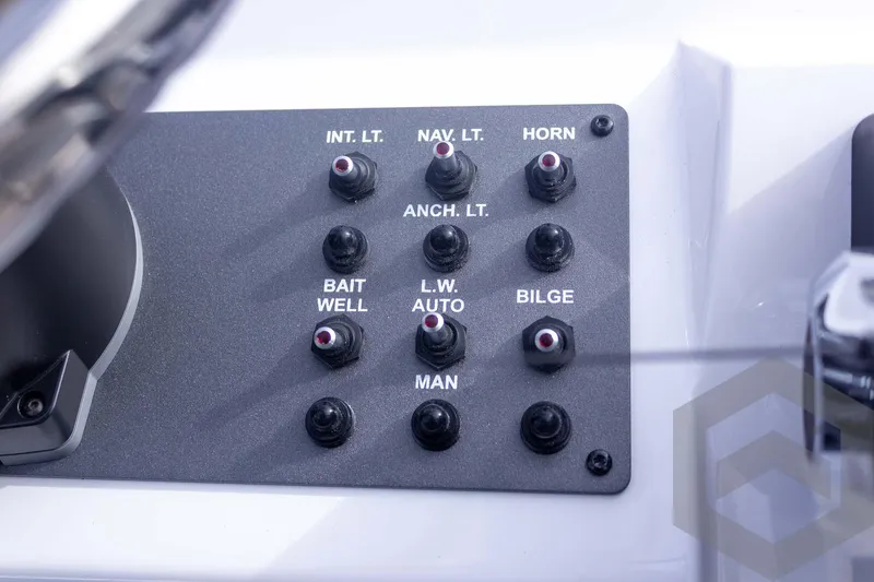 Slide: The Image of Control panel of 2026 Vexus ACX 2150 boat with labeled switches. - 40