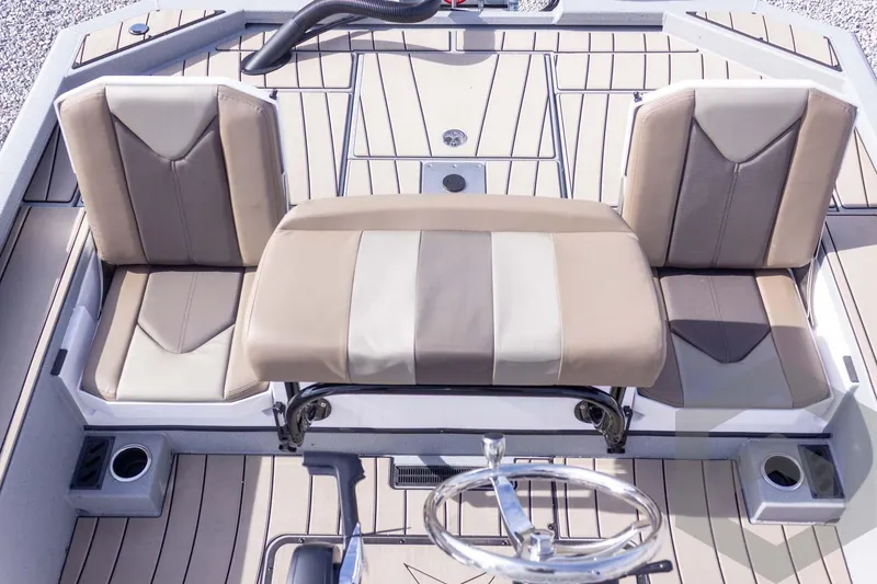 Slide: The Image of 2026 Vexus ACX 2150 boat interior with beige and brown seating and steering wheel. - 42