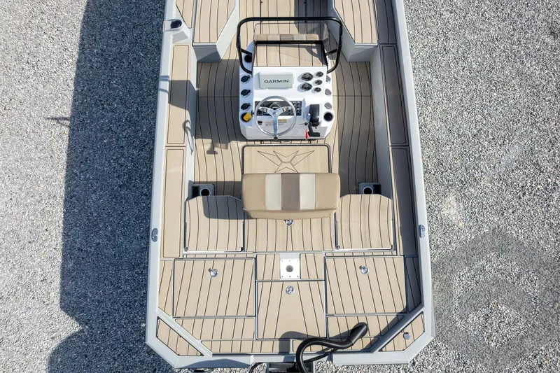 Slide: The Image of Top view of 2026 Vexus ACX 2150 boat with beige deck and modern controls. - 49