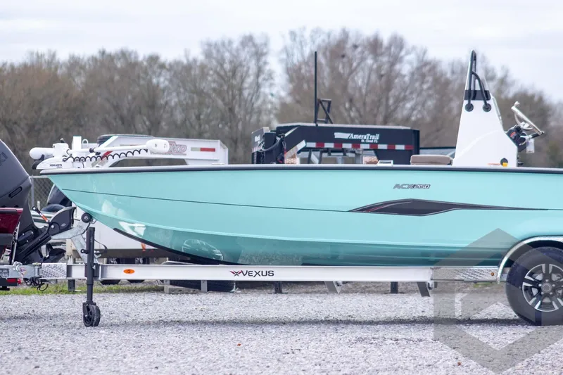 Slide: The Image of 2026 Vexus ACX 2150 boat on trailer, displayed outdoors with trees in background. - 5