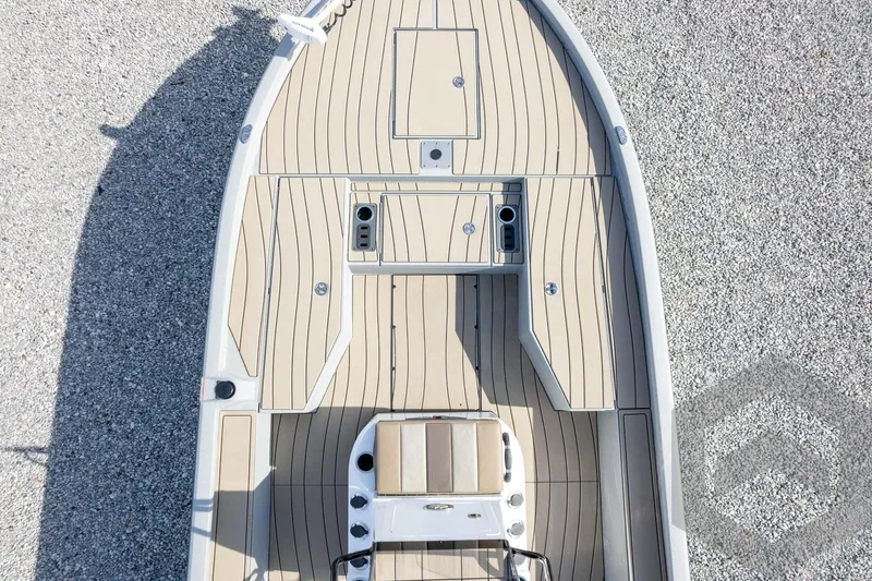 Slide: The Image of 2026 Vexus ACX 2150 boat deck with beige flooring and seating, viewed from above. - 50