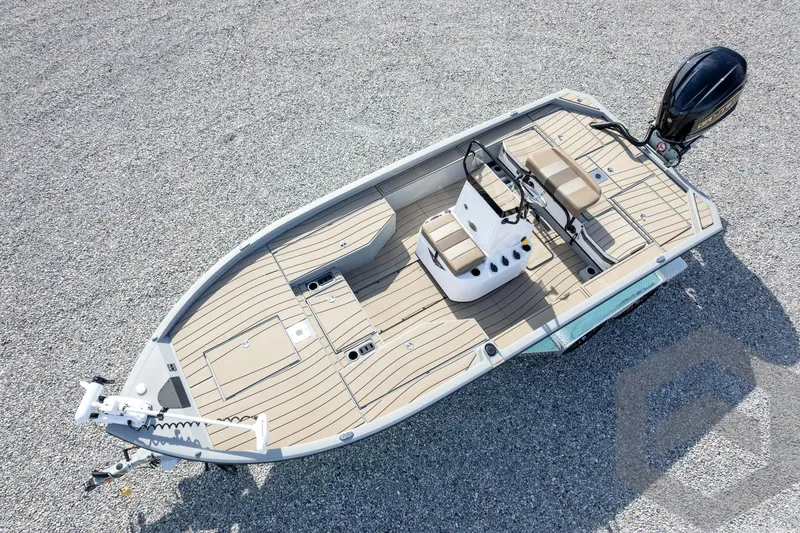 Slide: The Image of 2026 Vexus ACX 2150 boat, aerial view, beige deck, modern design, gravel background. - 51