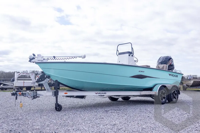 Slide: The Image of 2026 Vexus ACX 2150 boat on trailer, turquoise hull, parked on gravel. - 6
