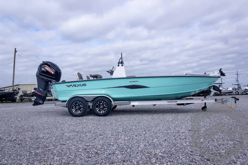 Slide: The Image of 2026 Vexus ACX 2150 boat on trailer, parked on gravel lot under cloudy sky. - 9