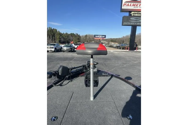 Slide: The Image of Nitro Z18 Pro 2026 boat seat and deck, parked outdoors under clear sky. - 10