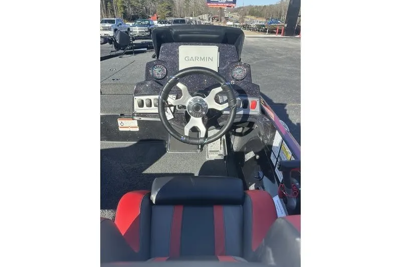 Slide: The Image of 2026 Nitro Z18 Pro boat dashboard with Garmin navigation system and steering wheel. - 3