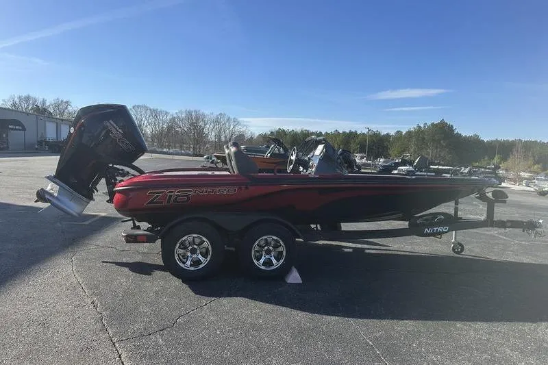 Slide: The Image of 2026 Nitro Z18 Pro boat on trailer in sunny outdoor setting. - 7