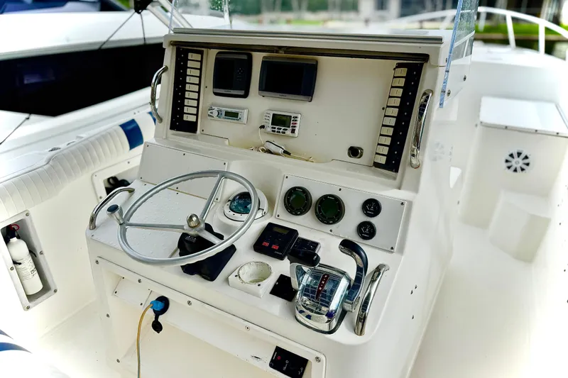 Slide: The Image of Suzuki engine display showing low battery voltage warning on Marlin 35 CC Sportfish, 1993 model. - 14