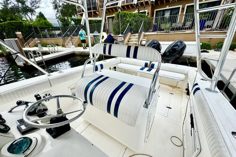 Slide: The Image of Fuel gauges on 1996 Marlin 35 CC Sportfish boat dashboard, Suzuki branded. - 16