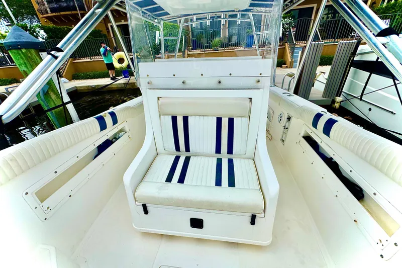 Slide: The Image of Control panel of a 1996 Marlin 35 CC Sportfish boat with Autopilot and Suzuki controls. - 17