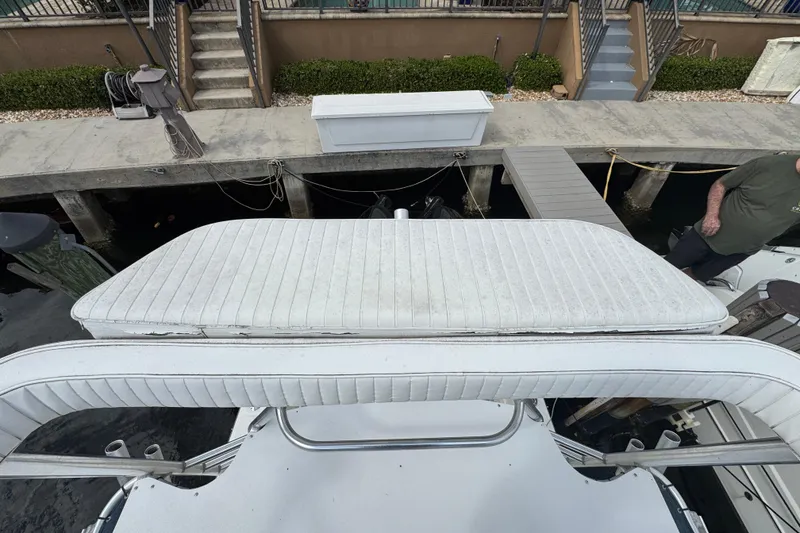 Slide: The Image of 1996 Marlin 35 CC Sportfish boat with cuddy cabin, docked at marina. - 35