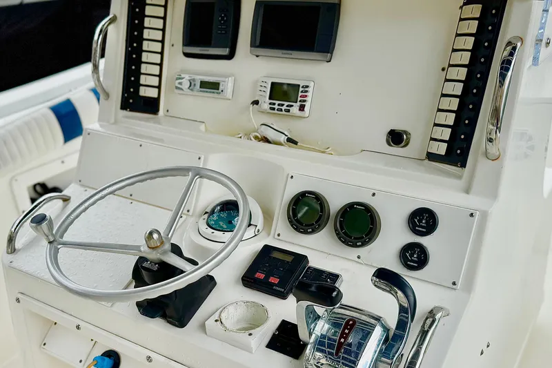 Slide: The Image of 1996 Marlin 35 CC Sportfish boat interior with cushioned seating and storage. - 8