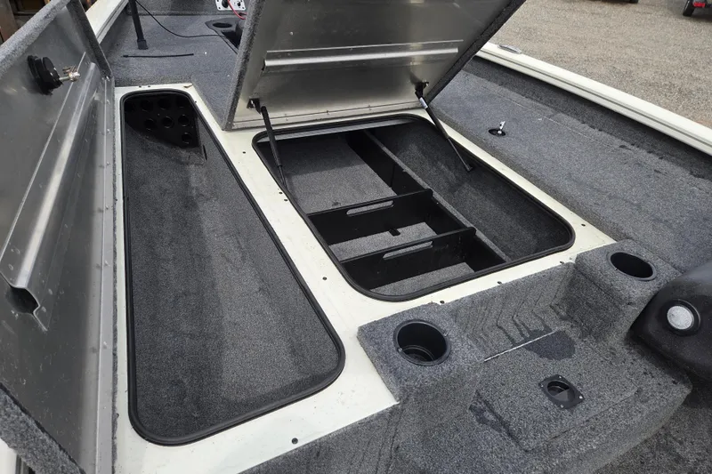 Slide: The Image of 2021 Tracker Pro Team 190 TX boat interior with open storage compartments. - 10