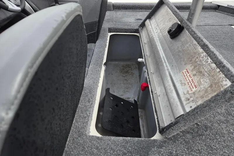 Slide: The Image of Open storage compartment in 2021 Tracker Pro Team 190 TX boat interior. - 11