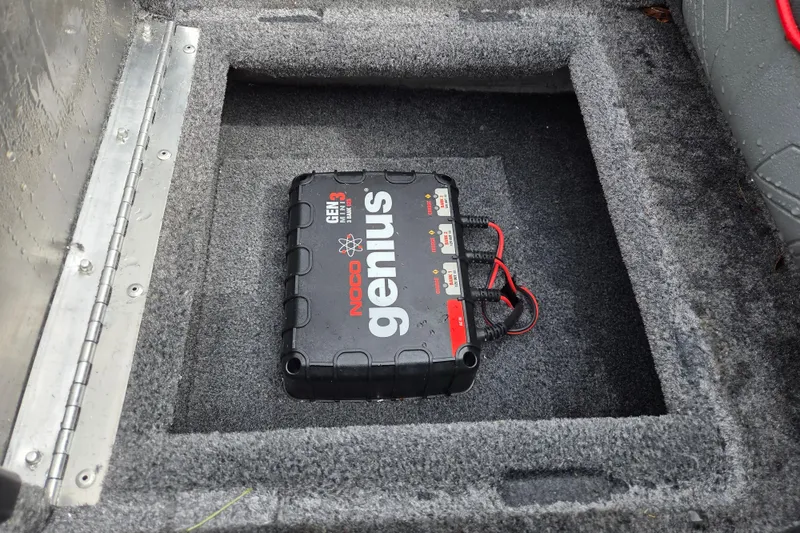 Slide: The Image of NOCO Genius GEN3 battery charger in 2021 Tracker Pro Team 190 TX boat compartment. - 12