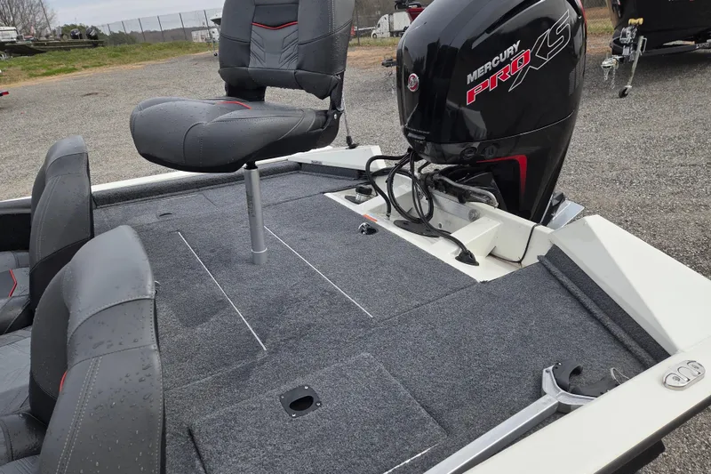 Slide: The Image of 2021 Tracker Pro Team 190 TX boat with Mercury Pro XS engine, featuring gray seating and carpeted deck. - 14