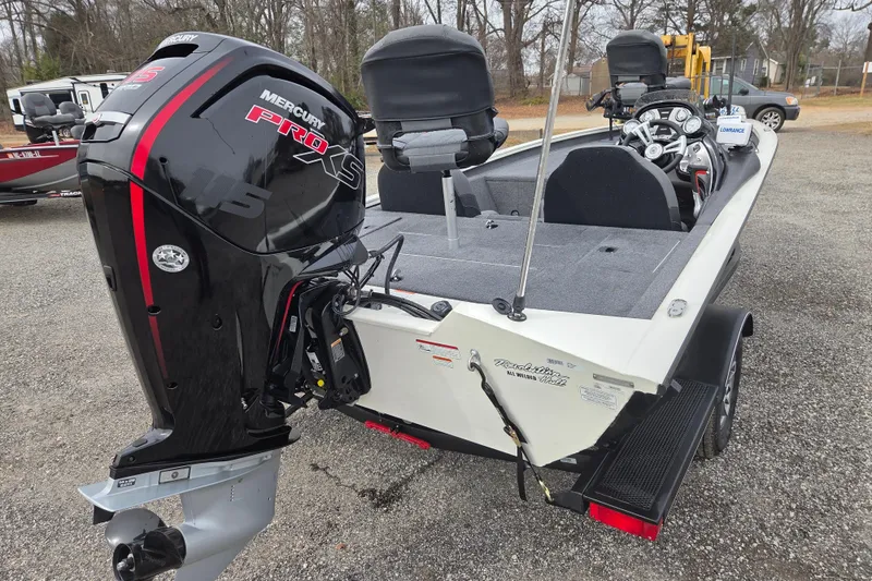 Slide: The Image of 2021 Tracker Pro Team 190 TX boat with Mercury Pro XS engine, parked outdoors. - 4