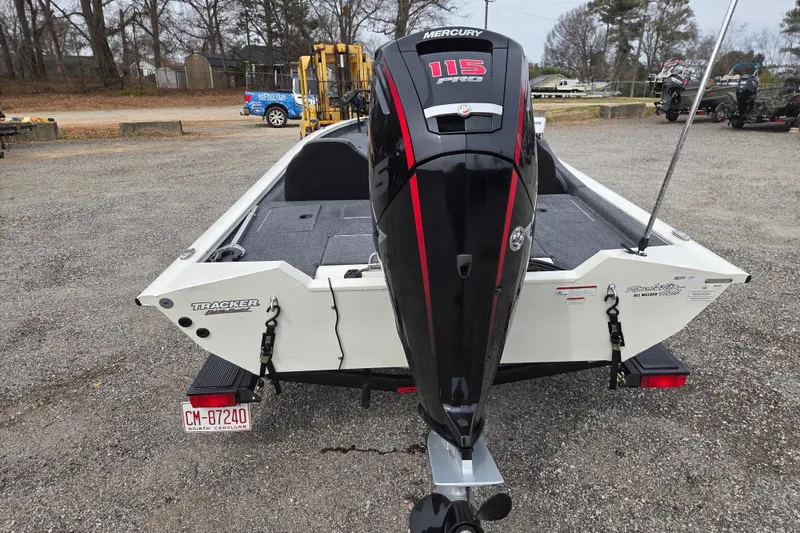 Slide: The Image of 2021 Tracker Pro Team 190 TX boat with Mercury 115 Pro XS engine, parked outdoors. - 5