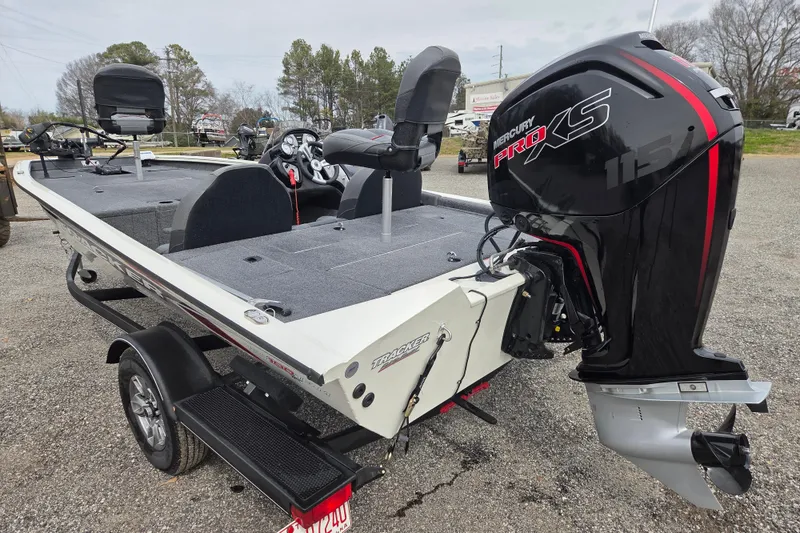 Slide: The Image of 2021 Tracker Pro Team 190 TX boat with Mercury Pro XS engine, parked outdoors. - 6