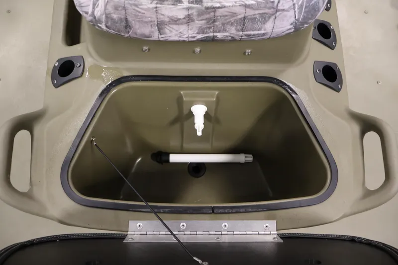 Slide: The Image of 2022 Tracker Grizzly 2072 MVX CC boat interior storage compartment with camo seat. - 21