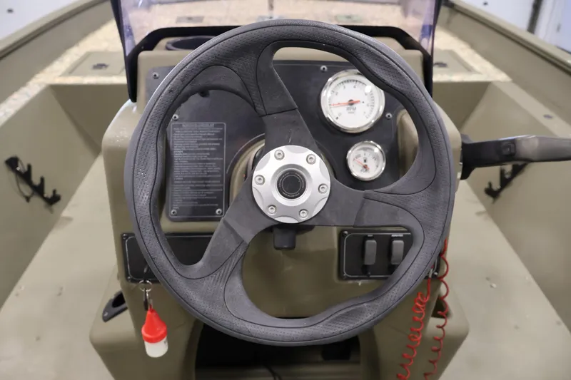 Slide: The Image of Steering console of 2022 Tracker Grizzly 2072 MVX CC boat with gauges and controls. - 25
