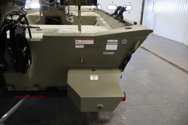 Slide: The Image of 2022 Tracker Grizzly 2072 MVX CC boat interior, showcasing rear deck and motor mount. - 34