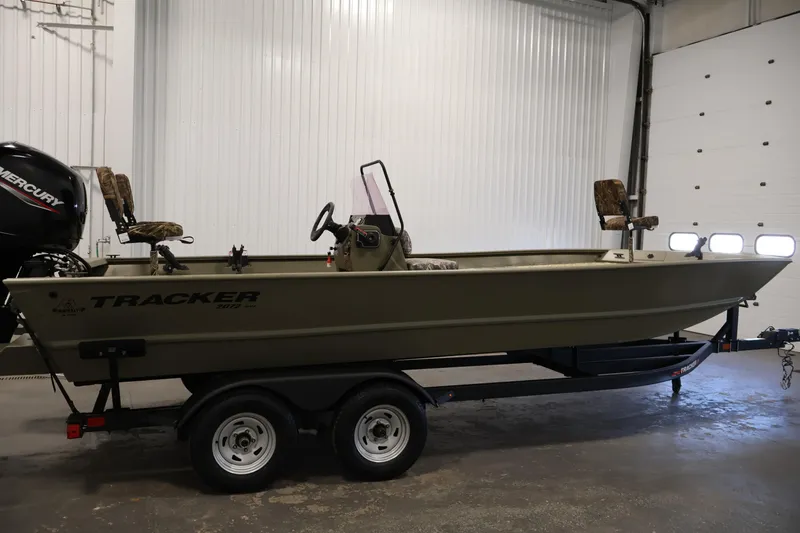 Slide: The Image of 2022 Tracker Grizzly 2072 MVX CC boat on trailer in indoor setting. - 4