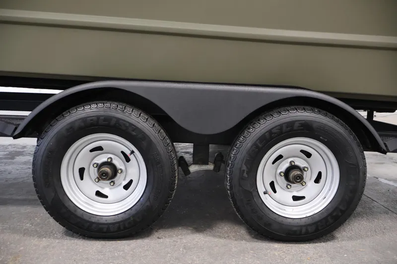 Slide: The Image of 2022 Tracker Grizzly 2072 MVX CC trailer wheels with Carlisle tires. - 42