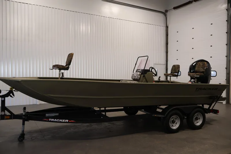 Slide: The Image of 2022 Tracker Grizzly 2072 MVX CC boat on trailer in indoor setting. - 8