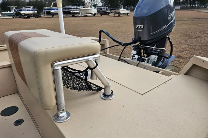 Slide: The Image of 2022 G3 Bay 17 boat with Yamaha 70 outboard motor, beige seating, and storage net. - 11