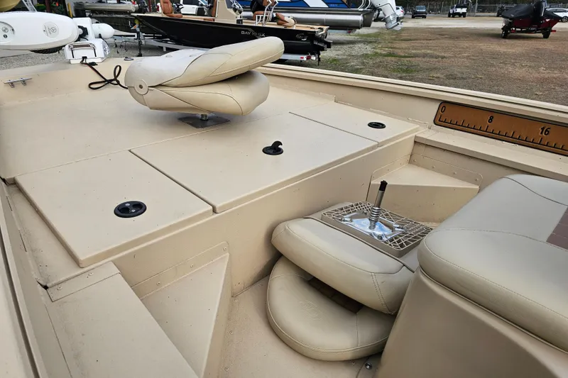 Slide: The Image of Interior of 2022 G3 Bay 17 boat with beige seating and storage compartments. - 12