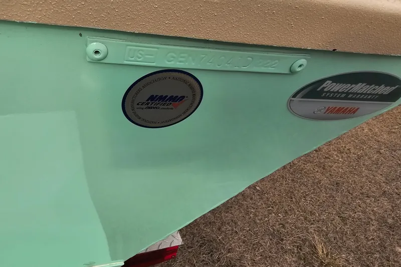 Slide: The Image of G3 Bay 17 boat, 2022 model, with certification and warranty stickers. - 17