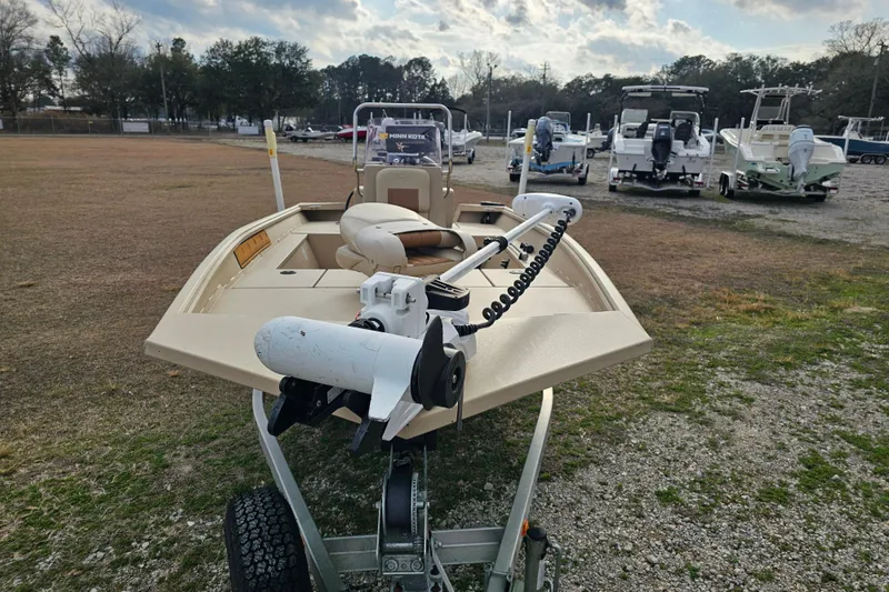 Slide: The Image of 2022 G3 Bay 17 boat on trailer, parked outdoors with other boats in background. - 4