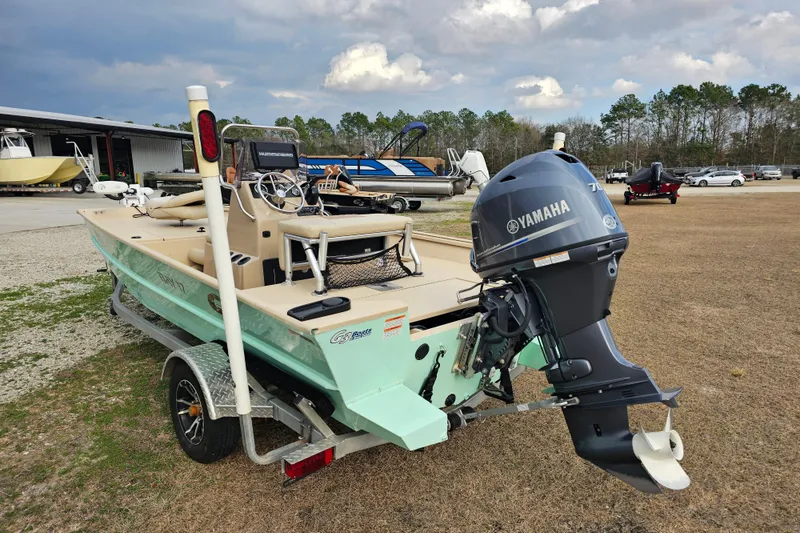 Slide: The Image of 2022 G3 Bay 17 boat with Yamaha motor on trailer, parked outdoors. - 9