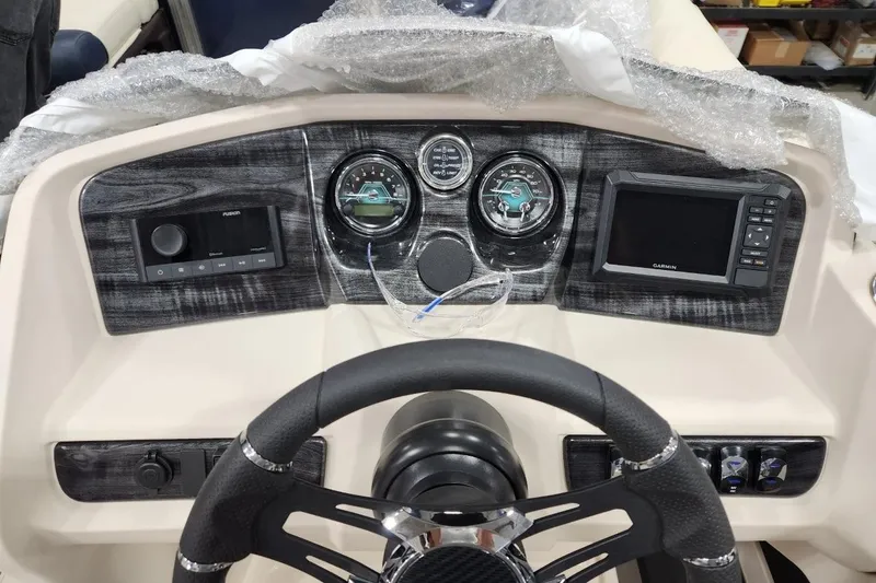 Slide: The Image of Dashboard of 2026 Avalon LSZ Elite boat with steering wheel and navigation controls. - 3