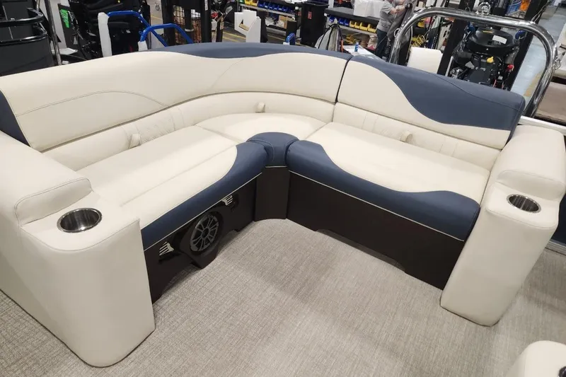 Slide: The Image of 2026 Avalon LSZ Elite 21' boat interior with plush seating and cup holders. - 6