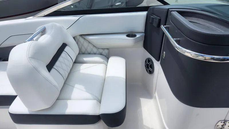 Slide: The Image of Luxurious white seating in a 2026 Regal LX4 boat interior. - 10