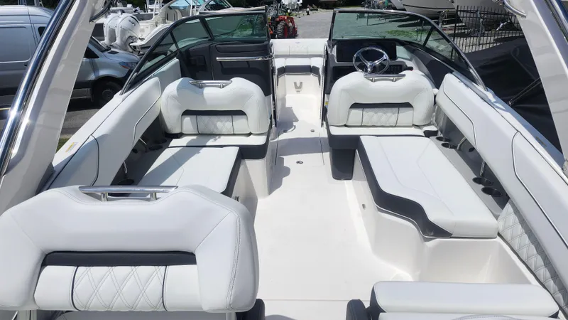 Slide: The Image of 2026 Regal LX4 boat interior with luxurious white seating and modern steering wheel. - 14