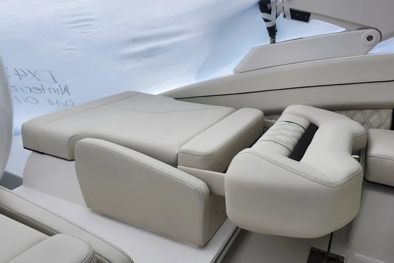 Slide: The Image of Luxurious seating in 2026 Regal LX4 boat, featuring elegant white upholstery and modern design. - 16