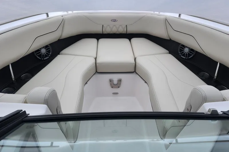 Slide: The Image of Luxurious interior of 2026 Regal LX4 boat with plush white seating and modern design. - 17
