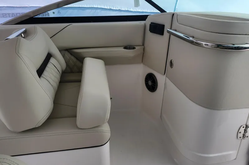 Slide: The Image of Luxurious interior of 2026 Regal LX4 boat with beige leather seating. - 20