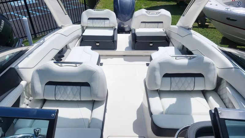 Slide: The Image of 2026 Regal LX4 boat interior with luxurious white seating and modern design. - 6